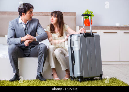 Wife seeing her husband off to business trip Stock Photo