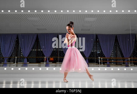Young ballerina in training hall Stock Photo