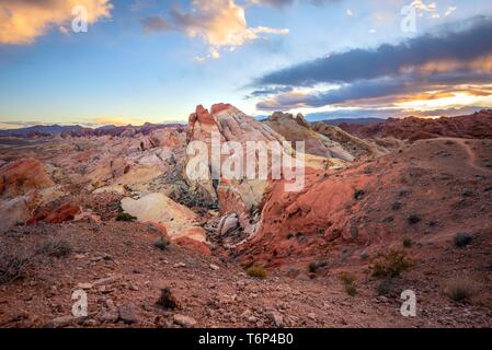 Colorful Red Orange Sunset Rock Formations, White Dome, Sandstone Rock, Valley of Fire State Park, Mojave Desert, Nevada, USA Stock Photo