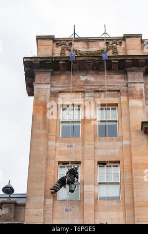 Glasgow, Scotland, UK. 2nd May, 2019. UK Weather. Abseiling window cleaner at work on a warm day with sunny intervals in George Square. Credit: Skully/Alamy Live News Stock Photo