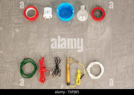 Flat lay composition with electrical tools on grey background Stock Photo