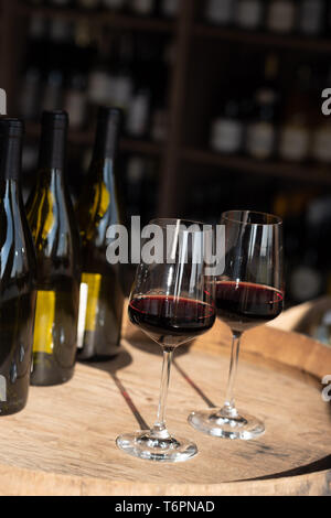 Two glasses of red wine on a cask *** Local Caption *** Stock Photo