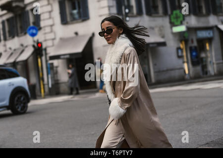 MILAN - SEPTEMBER 23: Woman with black Louis Vuitton bag with pink flames  before Antonio Marras fashion show, Milan Fashion Week street style on  Septe Stock Photo - Alamy