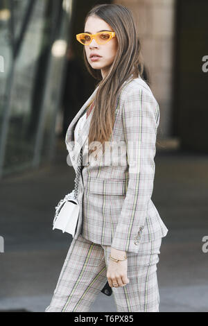Milan, Italy - February 24, 2019: Street style outfit before a fashion show during Milan Fashion Week - MFWFW19 Stock Photo