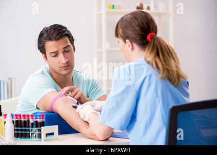 Young patient during blood test sampling procedure Stock Photo