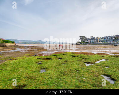 Low tide in the small harbour at Borth-y-Gest, near Porthmadog, at the end of a hazy spring day. Stock Photo