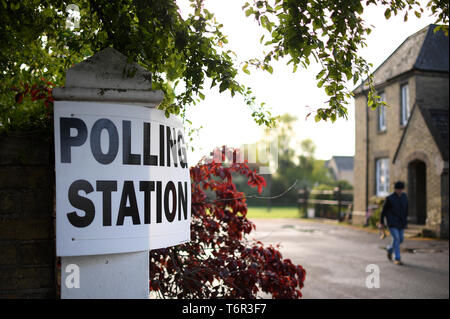 A man leaves the polling station at Bedford Hall in Thorney, Peterborough, as voters headed to the polls for council and mayoral elections across England and Northern Ireland. Stock Photo