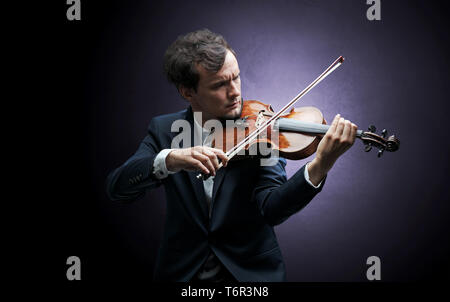 Lonely violinist composing on cello with nothing around Stock Photo - Alamy