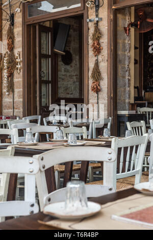 Outdoor restaurant seating in Chania center Stock Photo