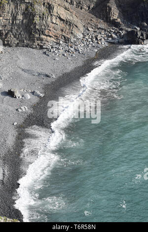 Breaking wave on an inaccessible beach Morwenstow Cornwall Stock Photo