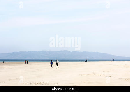 People on a beach walking, County Donegal, Ireland Stock Photo