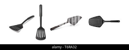 Black Plastic kitchen utensils. Spatula and strainer isolated on a white background. Stock Photo