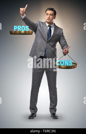 Businessman choosing pros and cons Stock Photo