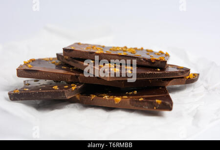 Chocolate pieces with almonds on white background Stock Photo