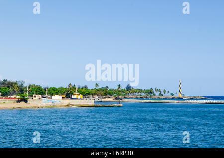 View of the port of Santo Domingo Dominican Republic from Juan Baron square, with beautiful sunny day and blue waters with boats arriving at port Stock Photo