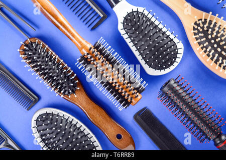 Flat lay composition with set of hairdresser's tools on color background Stock Photo