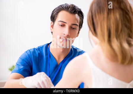Young patient during blood test sampling procedure Stock Photo
