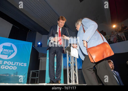 Brexit Party EU elections campaign launch at  The Neon in Newport, South Wales. Ann Widdecombe of the Brexit Party is helped onto the stage by Brexit Party Chairman Richard Tice. Stock Photo