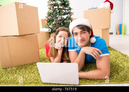 Young family celebrating christmas in new home Stock Photo