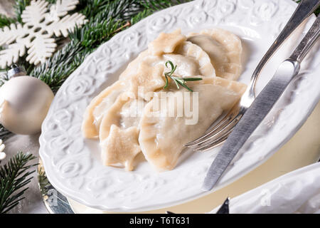 Polish style dumplings filled with sauerkraut and mushrooms Stock Photo