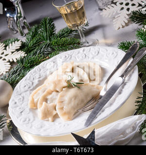 Polish style dumplings filled with sauerkraut and mushrooms Stock Photo