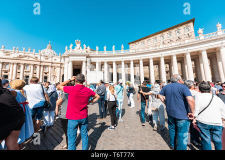 Vatican City, Italy - September 5, 2018: Many crowd of people in line queue to enter St Peter's Square Basilica crowd in Rome for papal audience mass Stock Photo