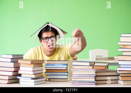 Student with too many books to read before exam Stock Photo