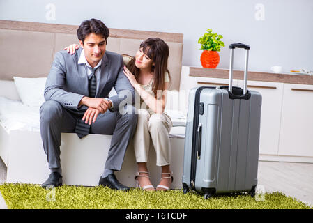 Wife seeing her husband off to business trip Stock Photo