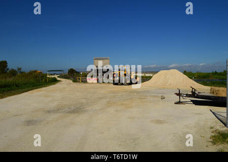 Heavy Machinery Road Construction on Lime Rock Earthen Florida Dirt Road Remote Industrial Area Diesel Fuel Pump Station Commercial Development Photo Stock Photo