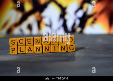 Scenario planning on wooden blocks. Cross processed image with bokeh background Stock Photo
