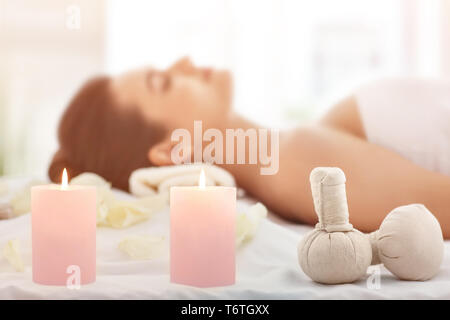 Spa accessories and relaxed young woman on background Stock Photo