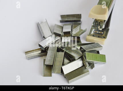 stapler and refill wire on white background Stock Photo