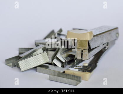 stapler and refill wire on white background Stock Photo