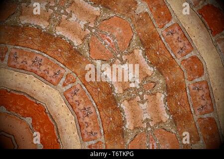 Abstract image created with a kaleidoscope filter. Orange brown brickwork. Stock Photo