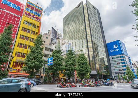 Tokyo, Taito-Ku, Akihabara - August 13, 2017 : Mario go-kart Cosplay driving carts in Akihabara Electric Town Chuo dori street with Colorful Bilboard  Stock Photo