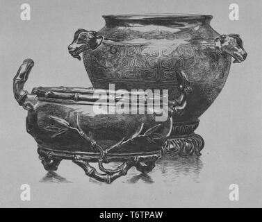Black and white etching depicting two antique, Japanese bronze pots; the taller pot in the background with goat head handles, a lotus base and an incised design on the body emulates Chinese bronzes from the Shang dynasty; the shorter pot in the foreground has bamboo decorative elements, including handles and three feet, the latter referencing the Chinese 'ding' form; titled 'Deux vases japonais, en bronze' (Two Japanese vases, in bronze); by the illustrator Felix Bracquemond, 1870. From the New York Public Library. () Stock Photo