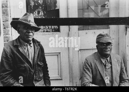 African American men posing for a photo in front of a sealed door, Waco, Texas, November, 1939. From the New York Public Library. () Stock Photo