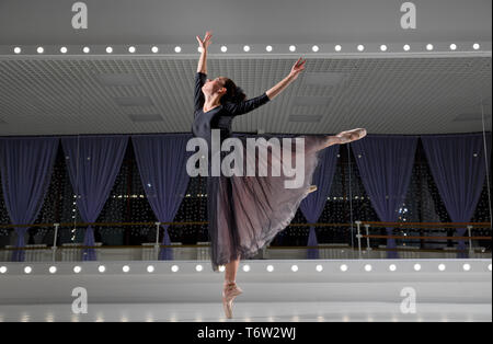 Young ballerina in training hall Stock Photo