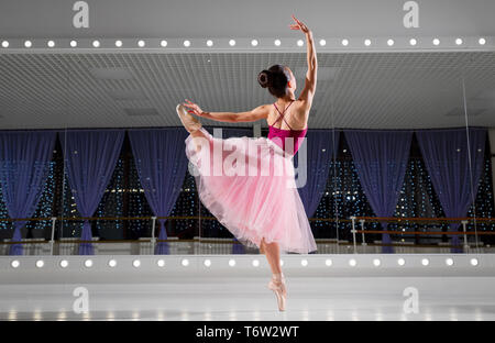 Young ballerina in training hall Stock Photo