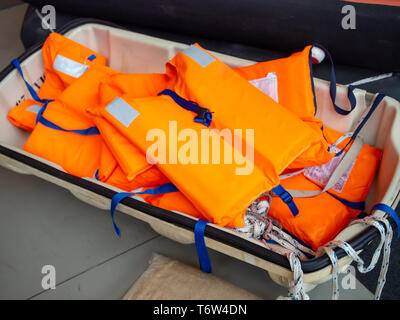Heap of orange life jackets Stock Photo