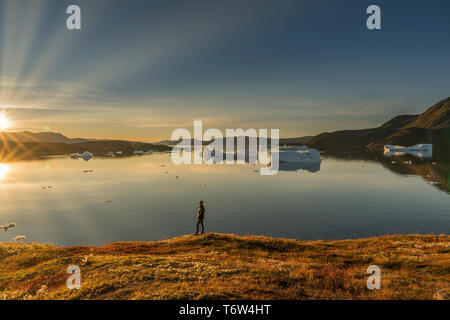 Woman at sunset, Narsaq, Tunulliarfik Fjord, South Greenland Stock Photo