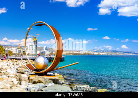 Beautiful sea promenade with palms, sculptures and pools in Limassol, Cyprus Stock Photo
