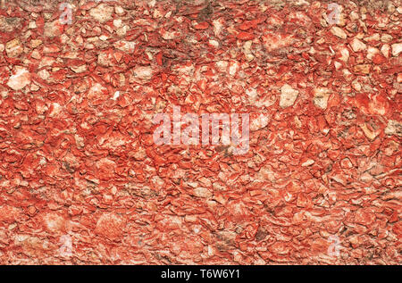 Red Mexican stone wall texture from a  hacienda in Yucatan. Stock Photo