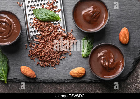 Composition with tasty melted chocolate on table Stock Photo