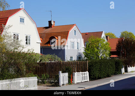 Block of two story single family wooden houses with mansard roofs erected duringthe 1920s era. Stock Photo