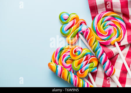 Various colorful lollipops on checkered napkin. Stock Photo