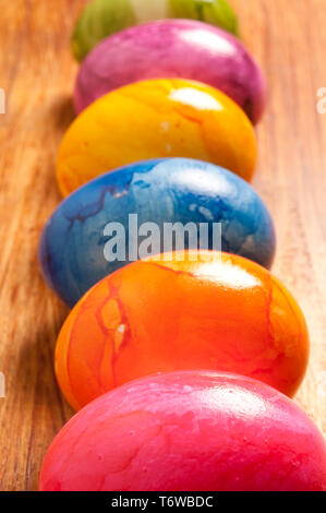 six colourful eggs in a row Stock Photo