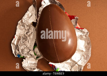 Easter traditional chocolate egg unwrapped Stock Photo