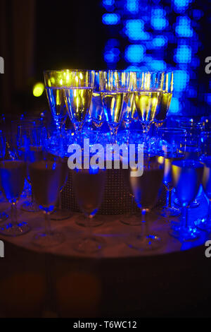 Many glass of wine on a table. Glasses with wine. Filled with half and stand on the holiday table. Furshet. selective focus Stock Photo