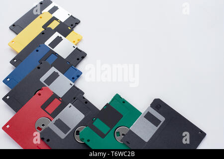 Lot of multi-coloured flexible disks isolated on a white background. Retro style. Stock Photo